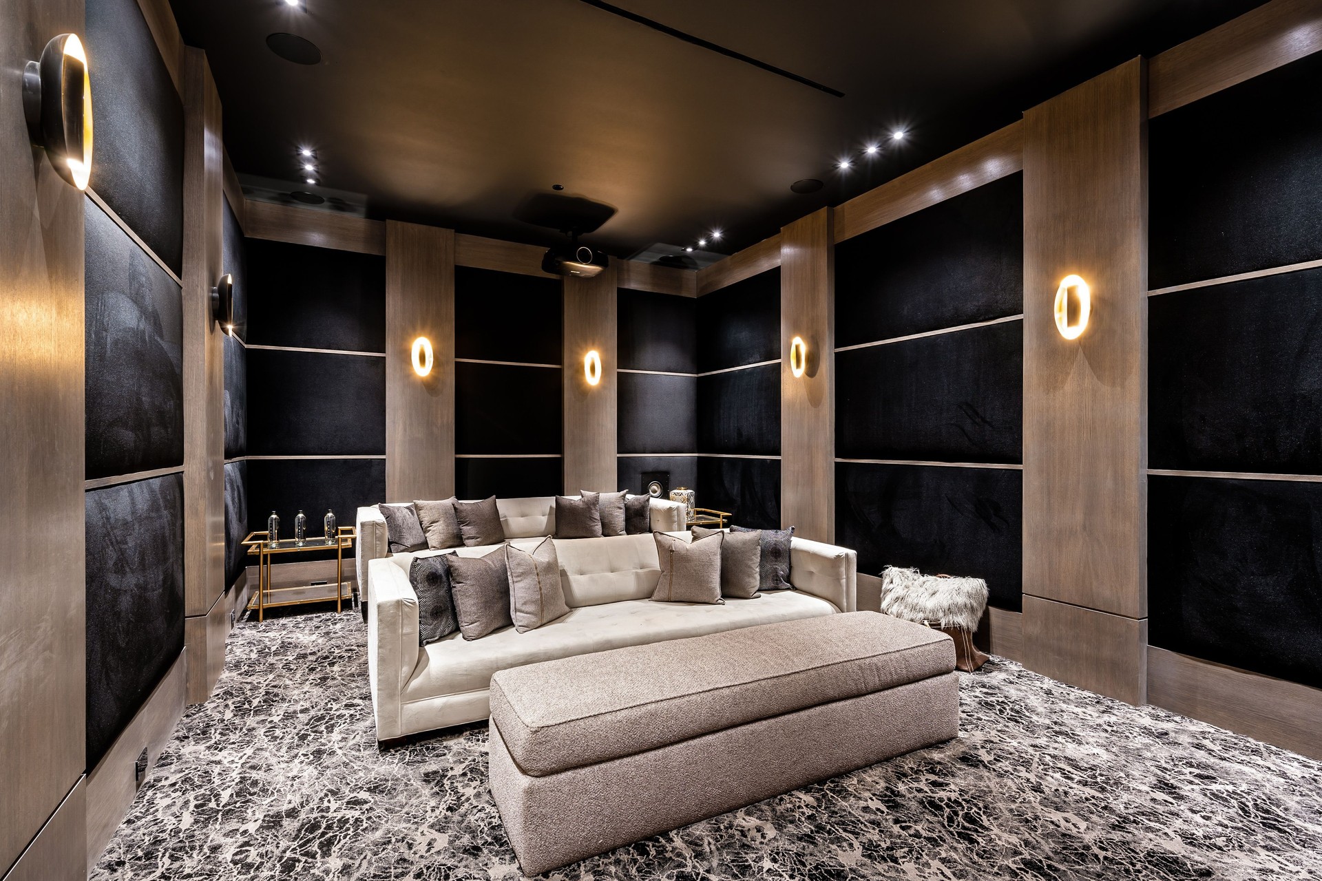 Luxurious home theater with modern decor and plush seating.